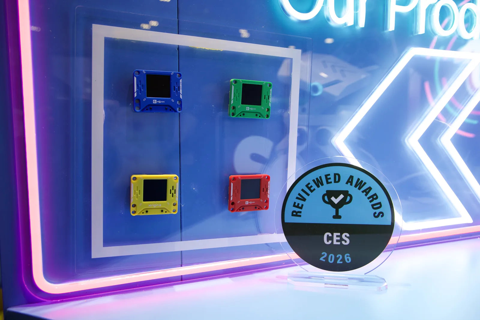 AIPI devices displayed beside a CES 2026 award at the booth