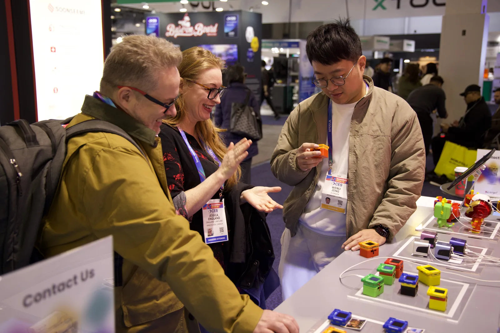 AIPI team member speaking with visitors at CES 2026